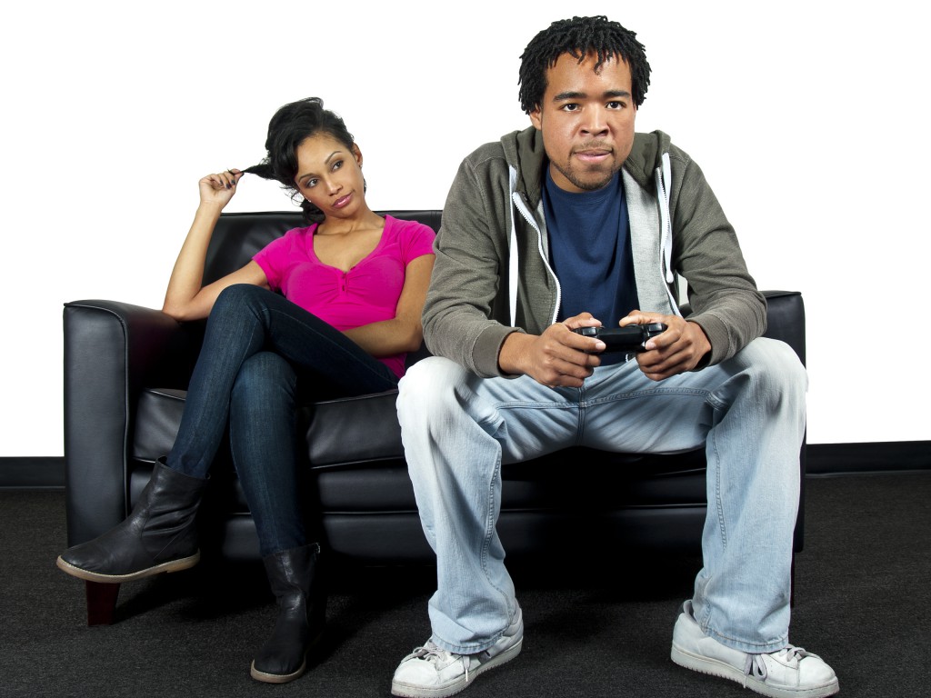 Black Male is Ignoring His Girlfriend While Playing Video Games